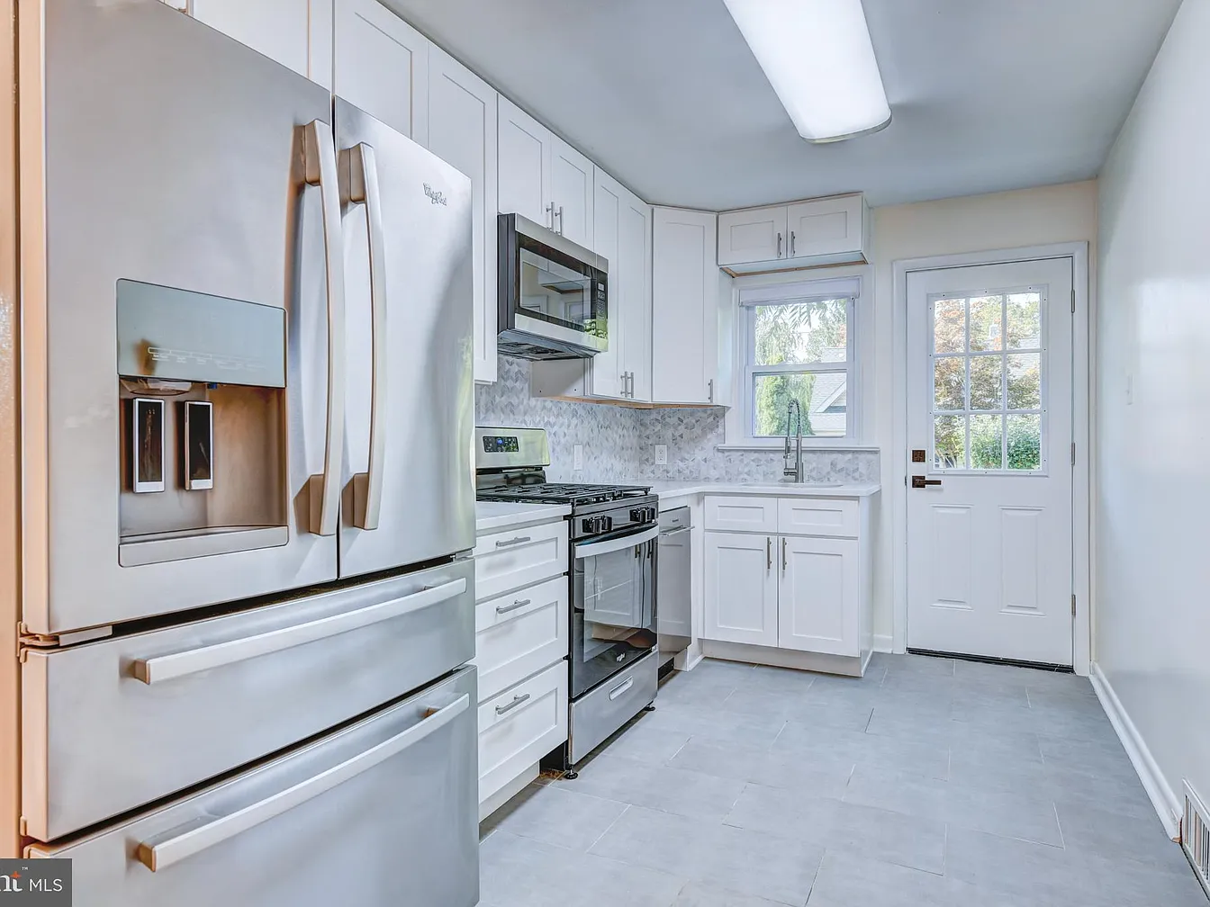 Renovated white kitchen at 1000 Tennis Avenue