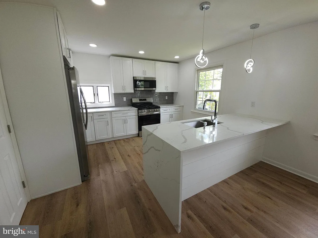 Renovated kitchen with quartz island at 2921 Senak Road